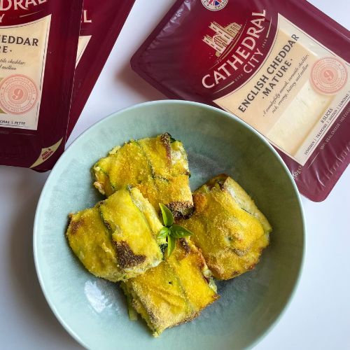 Fagottini di zucchine panati ripieni di prosciutto cotto e cheddar
