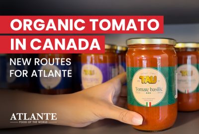 Jar of TAU organic tomato and basil sauce on supermarket shelf, part of the range developed by Atlante for Marchés Tau in Canada.